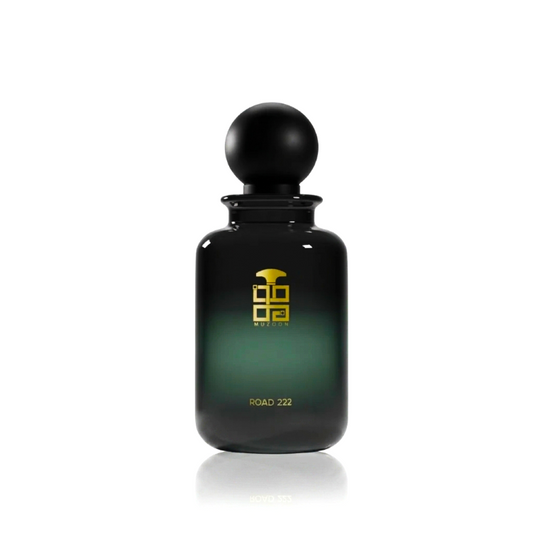 Road 222 EDP by Muzoon Perfume Black and green perfume bottle with black cap on a white background